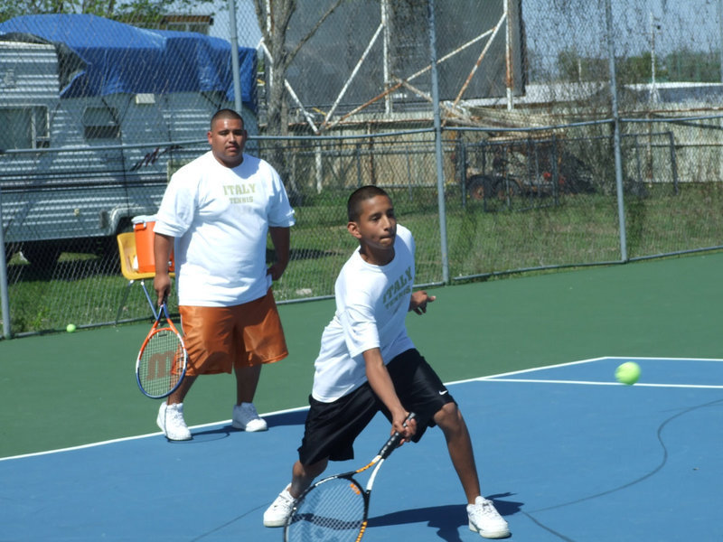 Image: “Cisco” and Eddie — Francisco Perez and Eddie Garcia pound away at the competition.