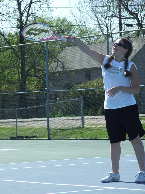 Image: Up and over — Krystal “Terminator” Johnson crushes the tennis ball.