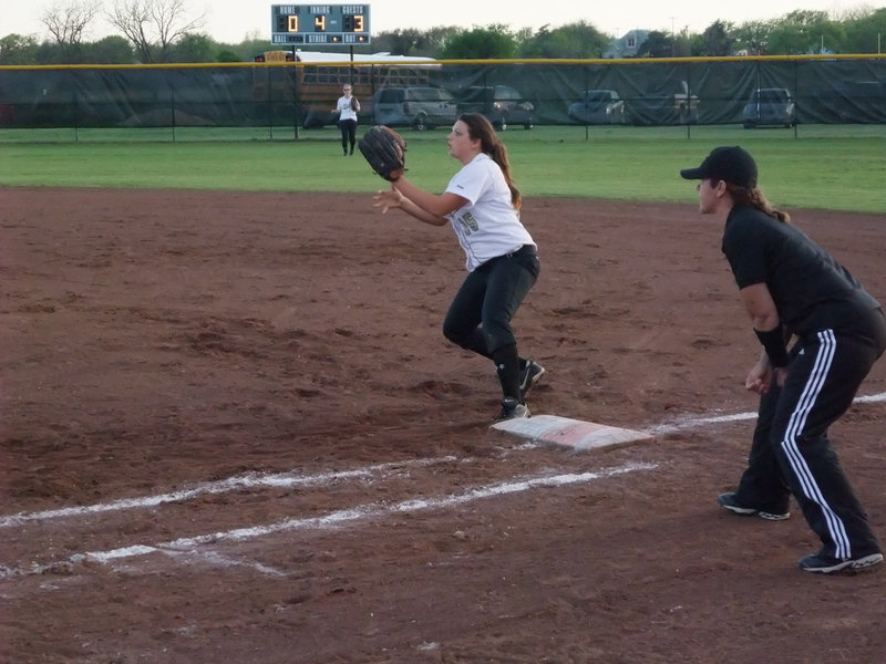 Image: Cori covers 1st — 2nd baseman Cori Jeffords covers 1st base while Drew Windham charged the bunt.