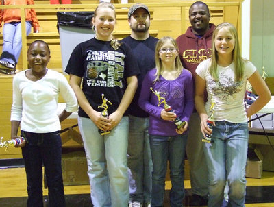 Image: Undefeated Division Champs, 9-0 — Kabreona Davis, Jaclynn Lewis, Coach Barry Byers, Jennifer McDaniel, Commissioner Glen McLendon and Madison Washington are all smiles as they accept their 1st Place trophies representing the “Girls In Gold.”