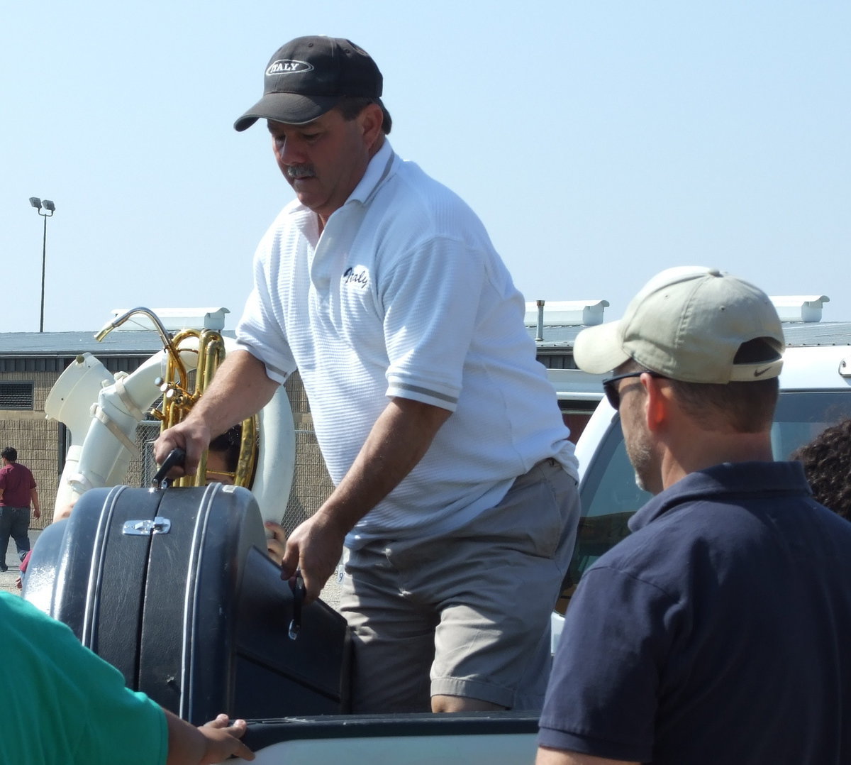 Image: Roadies — Italy ISD School Board vice-president, Larry Eubank and parent, Doug Nelson helped with unloading the equipment.