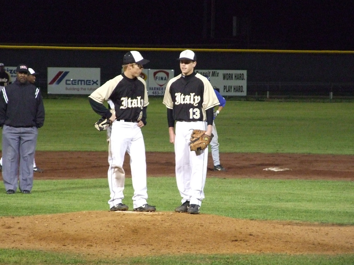 Image: Josh and Buck — Gladiators Josh Milligan and Justin Buchanan discuss the game during a break.