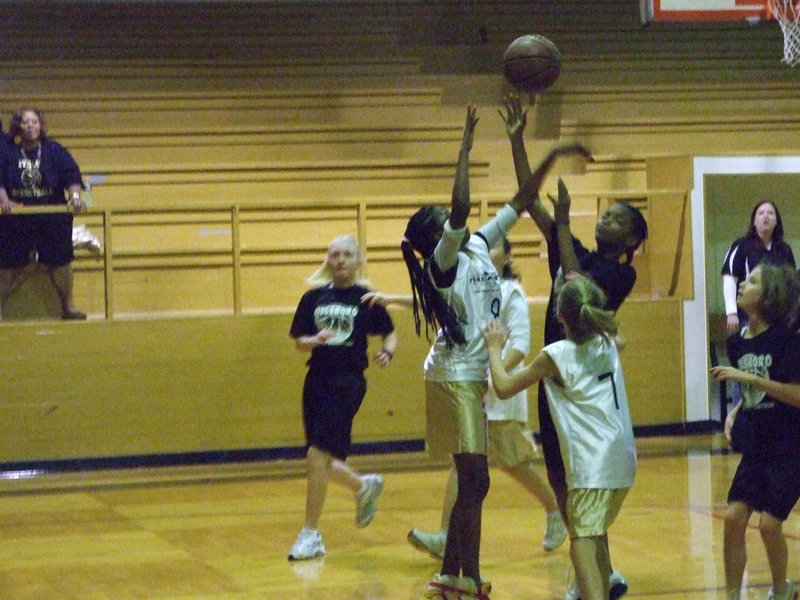 Image: Get outta here! — Janae Robertson #8 blocks Hillsboro black from the basket.