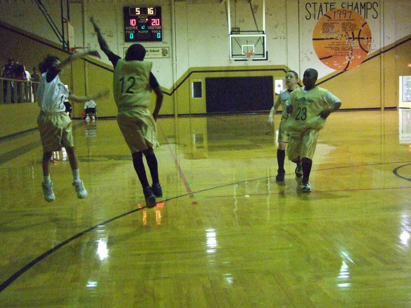 Image: Go for it! — Daren Cisneros #17 tries to shoot over Kevin Johnson #12.