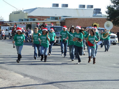 Image: Hurry up — The Italy High School Gladiator Regiment Band hurries into position to walk in the parade.