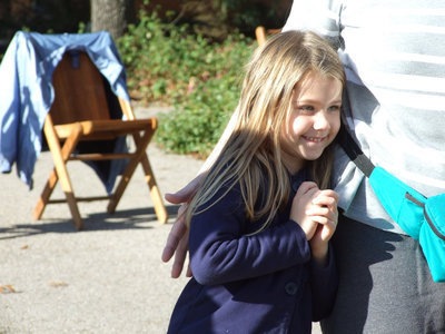 Image: I can’t wait for Christmas — One of the parade watchers was happy to see Santa.