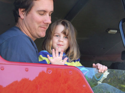 Image: Josh and Mia — The Droll family was happy to participate in the parade.  They took care of the Italy Firefighters.