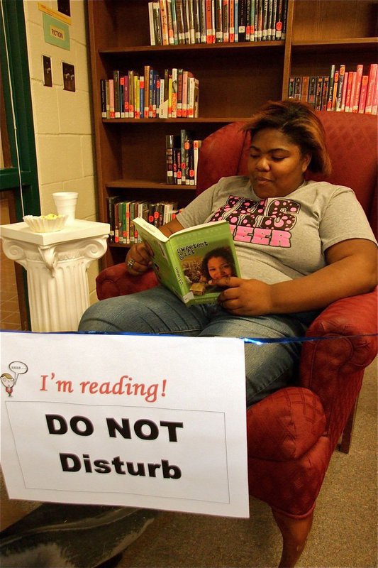 Image: Sa’Kendra Norwood — Sa’Kendra Norwood proves school mascots enjoy quality reading time as well during the IHS Reading Marathon.