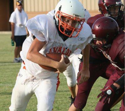 Image: North and South — Avalon’s Sophomore Quarterback Calyn Davis decides the quickest way to the endzone is straight ahead.