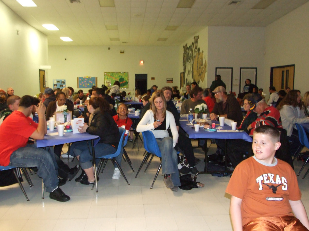 Image: It’s a Full House — Everyone is finishing dinner and ready for the play to begin.