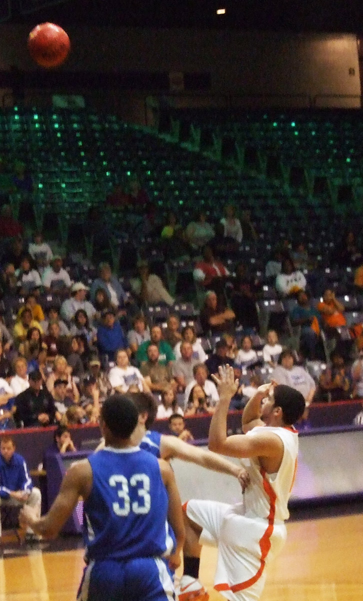 Image: Romero Shoots — Senior #11 Andrew Romero shows off is skills by making the shot while being fouled.