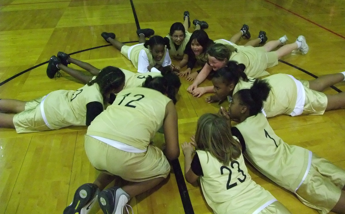 Image: We did it! — Coach Evan’s team celebrates their second straight undefeated season.