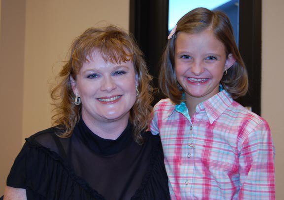 Image: Sportsmanship — ECEA President Julie Hinz, left, presents the Nancy Jessup Sportsmanship buckle to Emily Hammock of Waxahachie. The award was voted on by her fellow youth members and the buckle paid for by money raised by the youth at their fundraiser show held last month at the Flying Dollar Ranch.