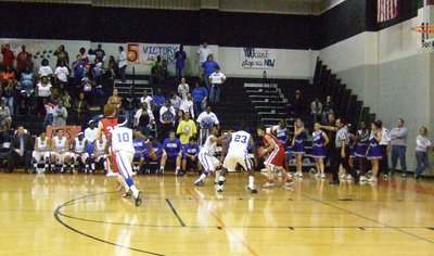 Image: All bark, and all bite! — Milford is unwilling to meet Midway at the halfcourt point. Instead, Milford utilizes their full court press to ground the Falcons.