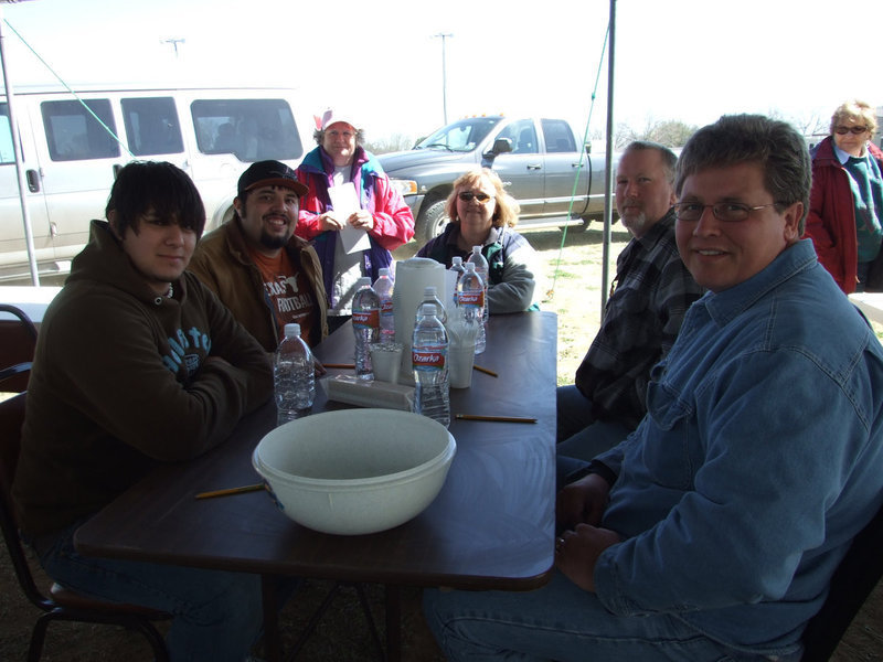 Image: Judges — These judges were judging the final round of chicken. Glenda Bowling (at the very back of the table) said,“I am the head judge for the Lone Star BBQ Society and am running the cook off. I have been doing this for four years. We do these cook-offs to help raise money for charities.”