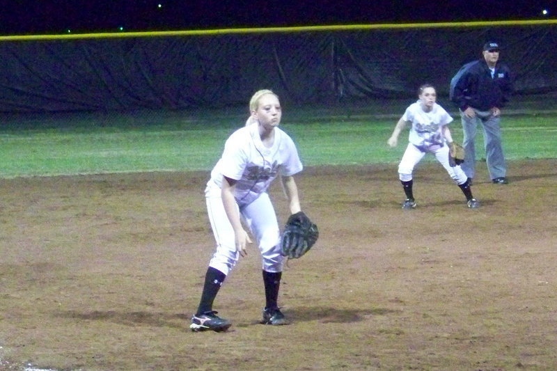 Image: Drew anticipates — Drew Windham anticipates a throw down to third while Megan stays light on her feet.