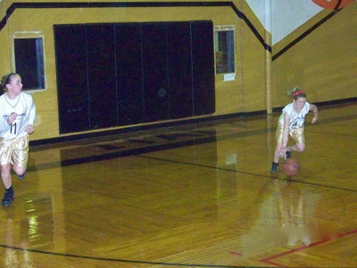 Image: Washington &amp; Wallis — Madison Washington #11 and Tara Wallis #9 advance the ball.