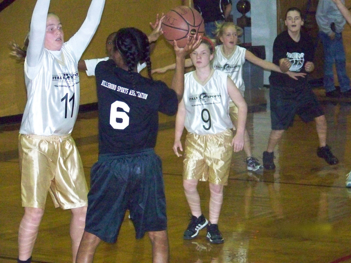 Image: D-fense! — Madison, K’Breona, Tara and Hannah play defense against Hillsboro.