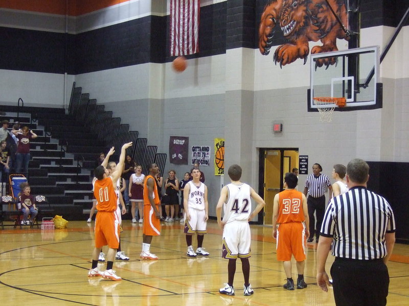 Image: Free-throws for Romero — Romero looks calm and relaxed while sinking 1 of 2 free-throws.