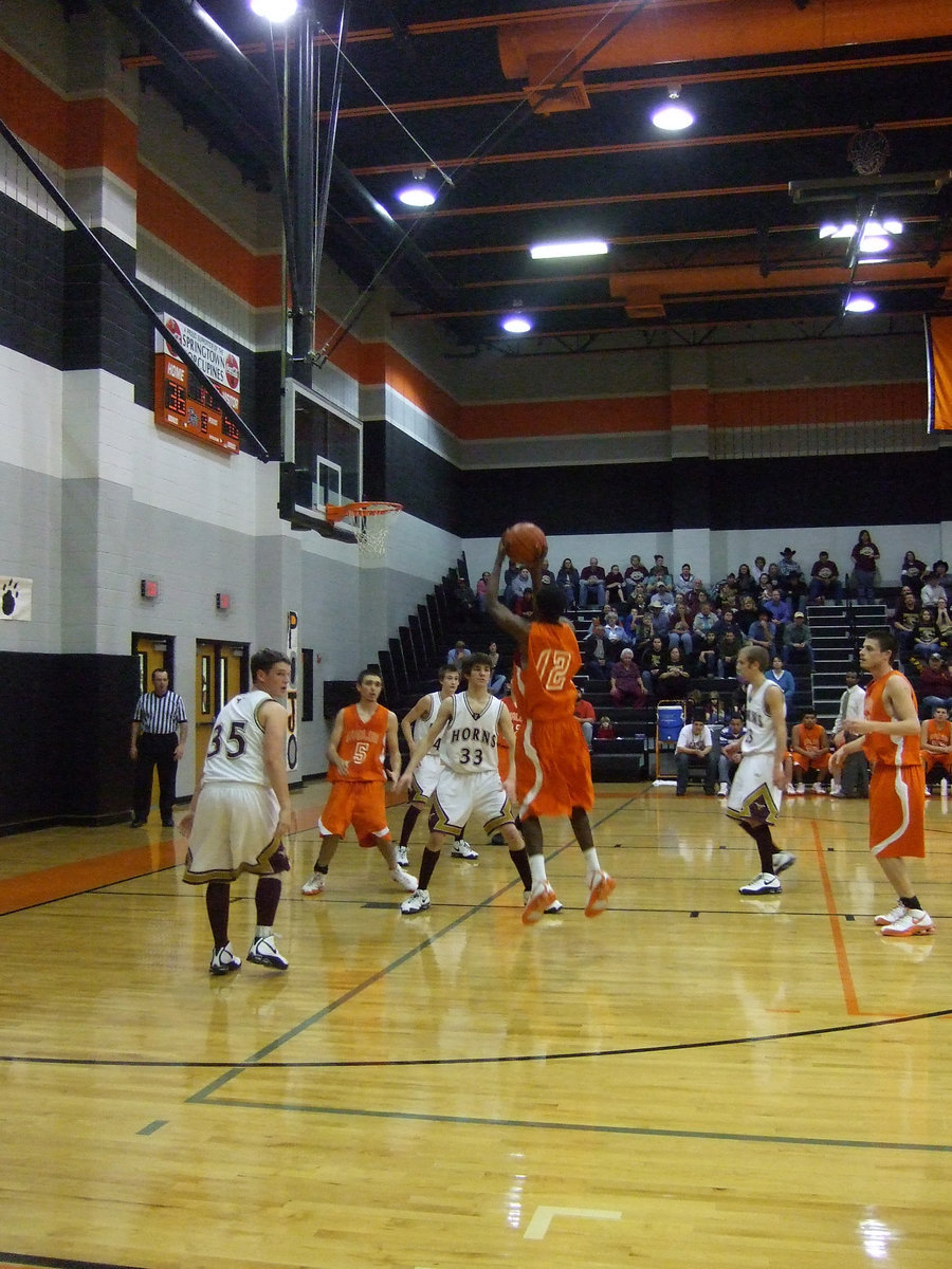 Image: 
    	Hughes — Dernard Hughes pulls up on a jump shot to add points to the board.
    