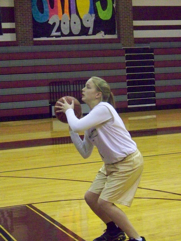 Image: Madison Washington — Madison “Maddog” Washington, who does it all for the “G.I.G.” takes aim from the free throw line before the game.