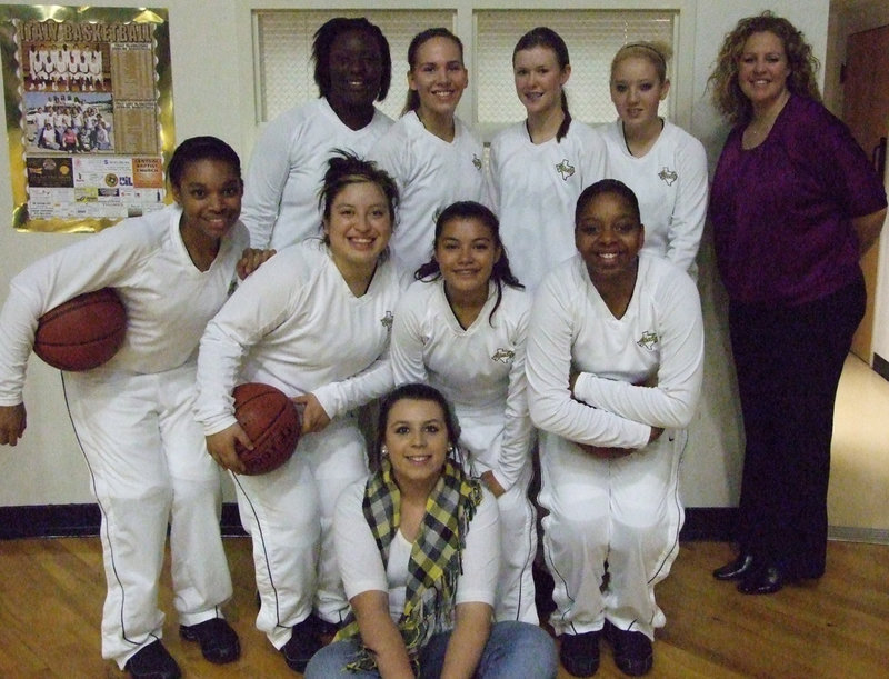 Image: Beauties And Braun — District has begun for the Lady Gladiators. They hosted Itasca at the dome Friday night.
(Back row L-R) Jimesha Reed, Becca DeMoss, Kaitlyn Rossa, Megan Richards and Coach McDonald. (Second row L-R) Kyonne Birdsong, Blanca Figueroa, Marisela Periz and Jaleecia Fleming. (On the floor) Manager, Molly Haight.