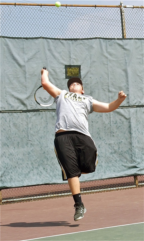 Image: I got it! — Kevin Roldan reaches back for the lob.