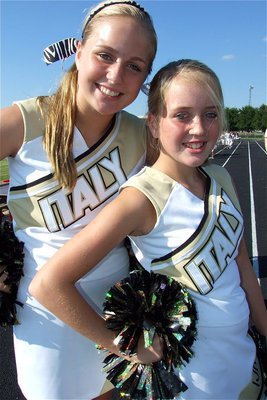 Image: Cheerful sisters — Sisters Madison Washington (8th) and Hannah Washington (7th) team up for to create school spirit.