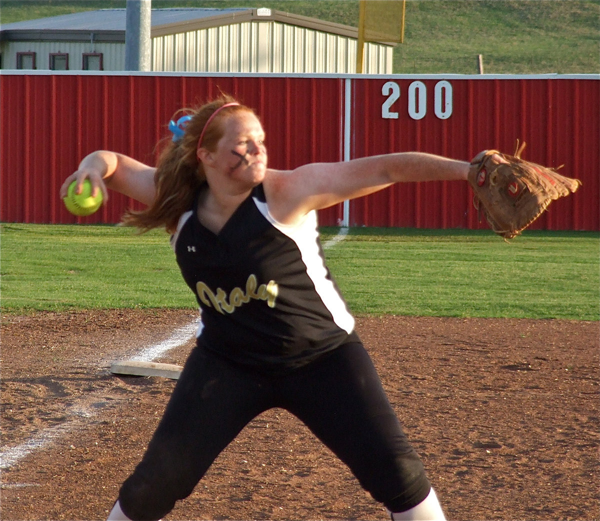 Image: With flare — Third baseman, Katie Byers, closes in on the bunt and guns down a Maypearl runner.