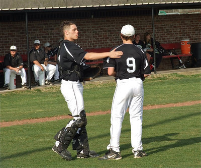 Image: Pep talk — Italy’s catcher, Brandon Souder, encourages his freshman pitcher, Bailey Walton, and helps Walton get back on track.