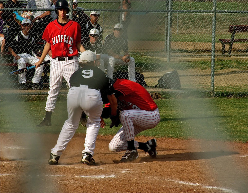 Image: Out at the plate — Bailey Walton makes up for a wild pitch after catcher, Brandon Souder, hustles to the fence, tracks and then fires the ball back to Walton who then tags the runner trying to steal from third base.