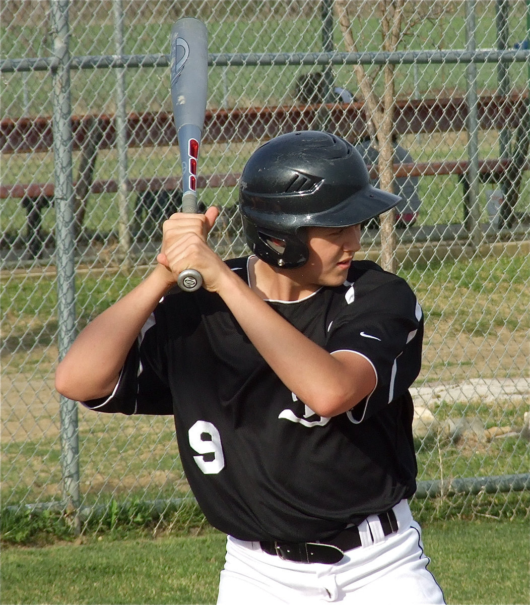Image: Pitcher and batter — Pitcher, Bailey Walton, is a threat with a bat in his hands as well.
