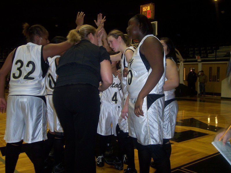 Image: Excitement In The Huddle — Head Basketball Coach Stacy McDonald huddles with her squad after Megan Richards hit a jumper with 2.8 seconds left in the game to give Italy a win and a place in the Italy Invitational Tournament Championship. Italy won the second round game 35-31 and will play for the championship Saturday, December 6th at 6:00 p.m.