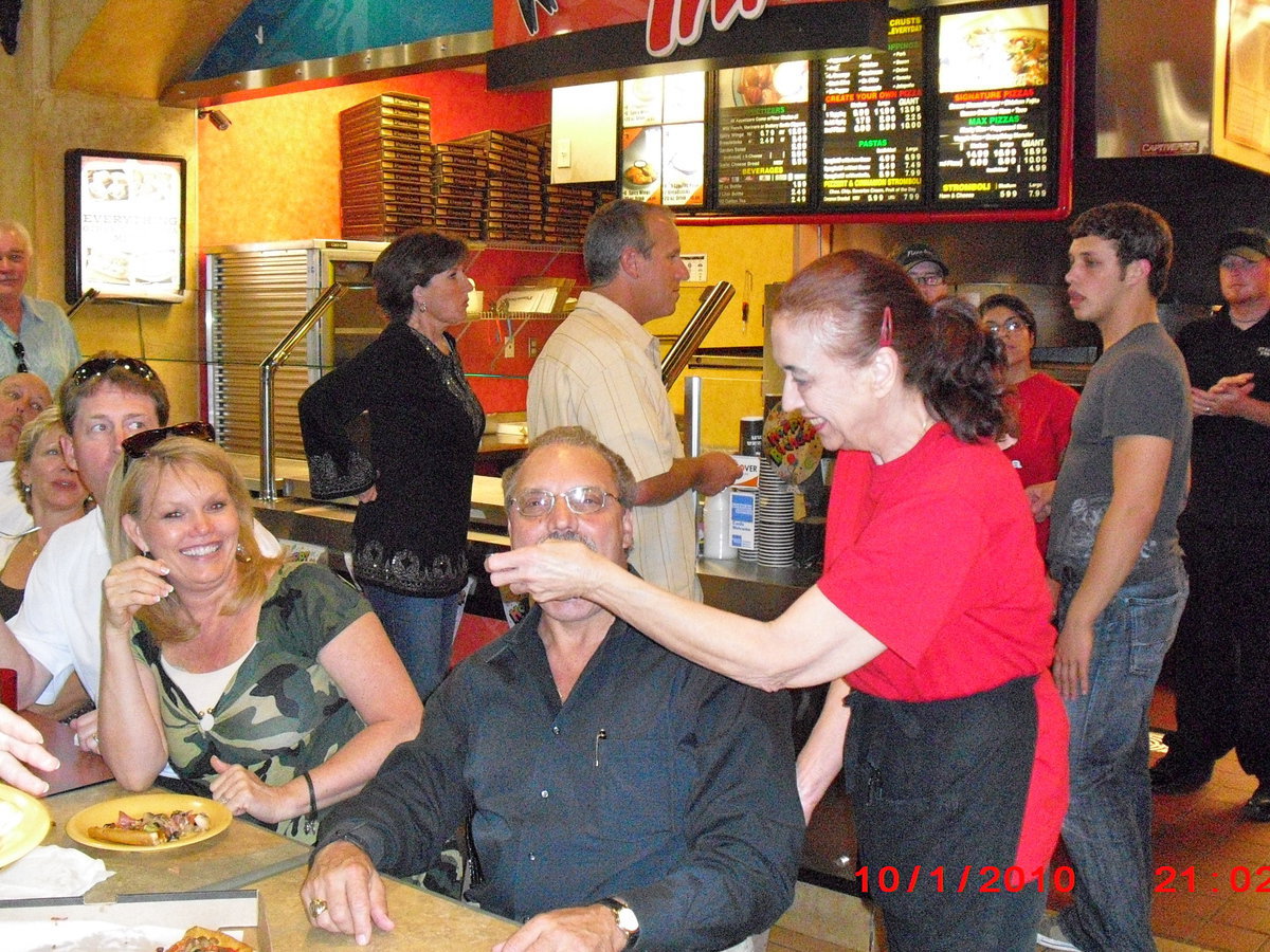 Image: Take A Bite — Shanna Miller is serving up the pizza with a smile!