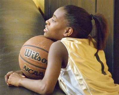 Image: Calm before the chaos — Italy 24’s DeCorea Green(1) takes a moment relax before the big game.