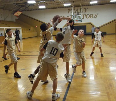Image: Turbulence — Ryan Connor runs into a little turbulence as Cameron Carter(11) and Hunter Ballard(1) try to keep him grounded.