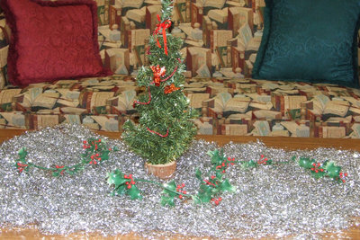 Image: Holiday decorations — Some of the students helped Mrs. Farmer decorate the library for the Christmas season.  There are lots of comfy places to read.