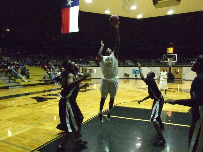 Image: Down the lane — Gladiator Larry Mayberry(13) carves a path through the lane.
