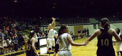 Image: Megan launches — Lady Gladiator Megan Richards(22) releases a three-point shot attempt against Grandview.