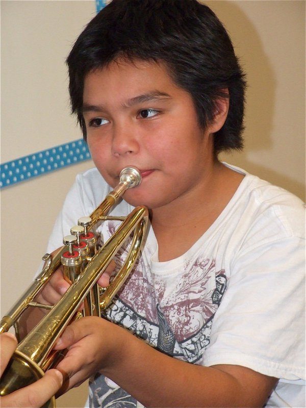 Image: Try outs — Isidro blares away on the trumpet.