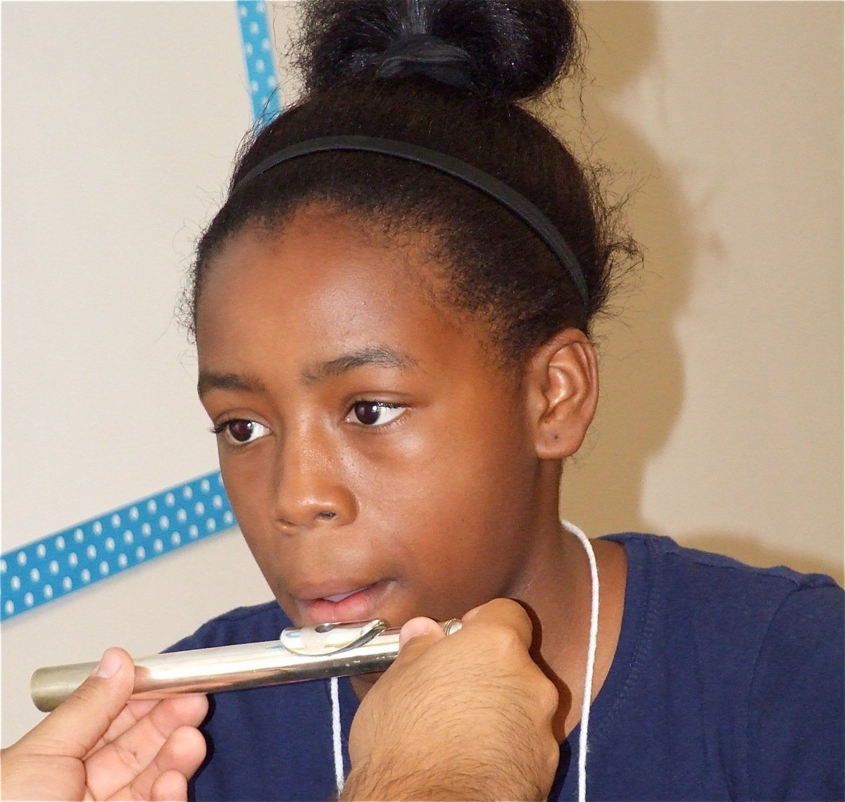 Image: Easy enough — Quintera tries to master the flute.