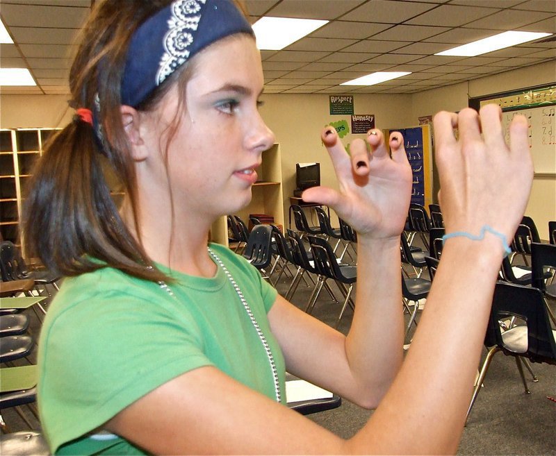 Image: Just add trumpet — Aaron plays air trumpet while hoping the community will be able to provide instrument or financial donations to the 6th grade band.