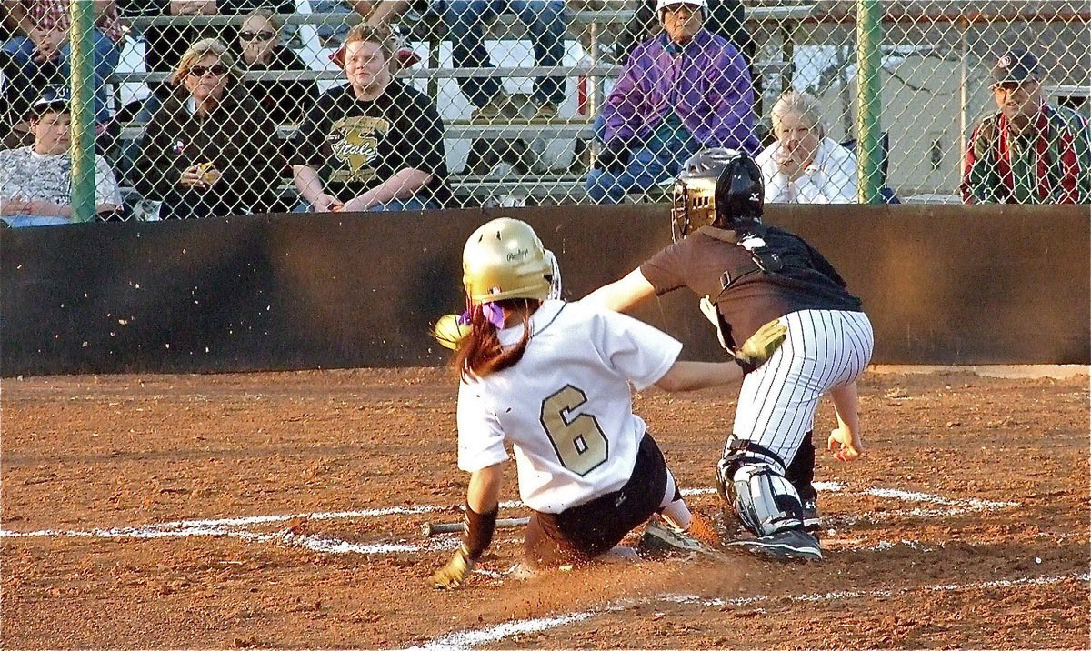Image: Making plays — Anna Viers(6) slides into home and gives Italy a 1-0 lead over the Palmer Lady Bulldogs.