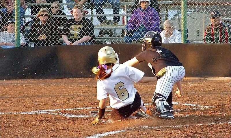 Image: Making plays — Anna Viers(6) slides into home and gives Italy a 1-0 lead over the Palmer Lady Bulldogs.