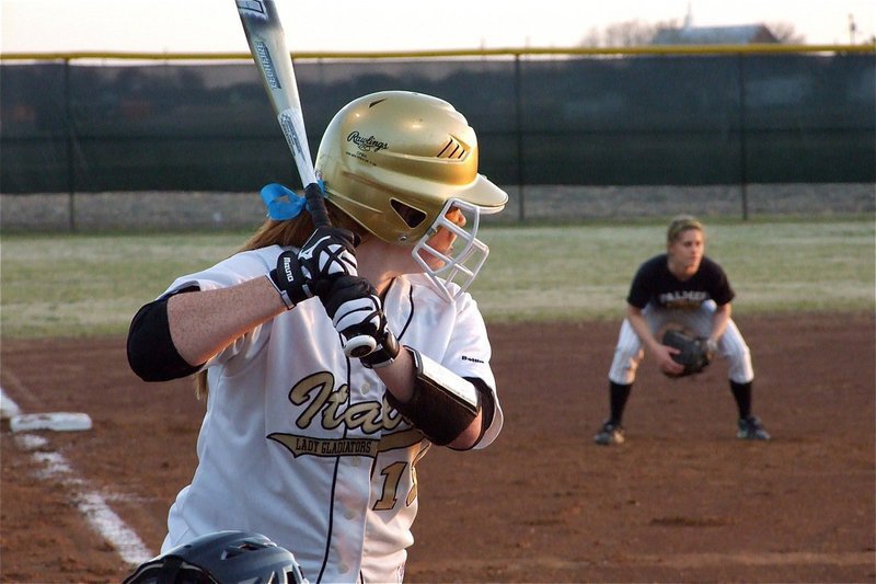 Image: Katie stands in — “Yeah, I was nervous.” said Katie Byers after taking her first swings of the 2011 season. Katie is also a Lady Gladiator Softball legacy following the path left by her sister, Lauren Byers. Lauren was also at the game showing her support for this years team.
