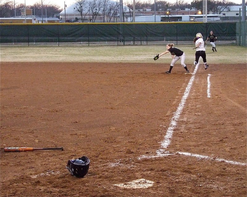 Image: Anna beats out throw — Italy’s Anna Viers hits and then beat’s out the throw to first for a bases-loaded single.