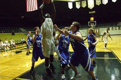 Image: Raheem “The Dream” — Raheem Walker(55) goes up for two of his four-points against Blooming Grove in the tournament championship game.