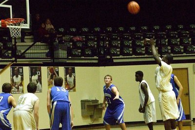 Image: Good form — T.J. Cockran(33) shoots a free-throw while teammate Jake Escamilla(11) prepares to rebound.