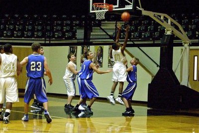 Image: Guard or center? — Italy point guard Eric Carson(10) shows his versatility on the backboards.