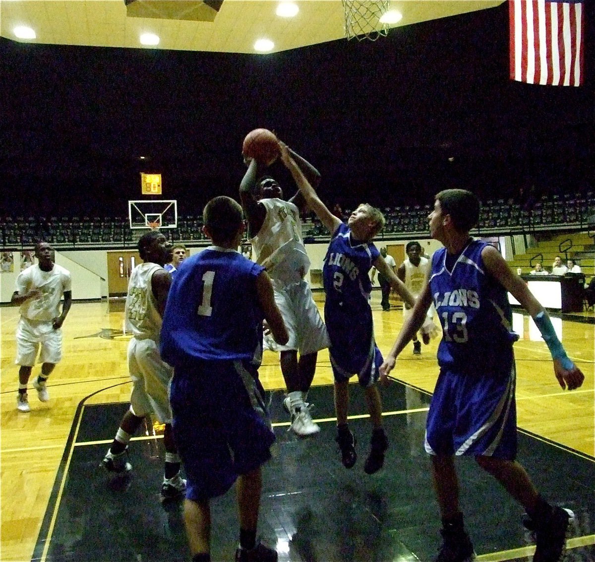 Image: Going up strong  — Italy puts up a shot inside the paint.